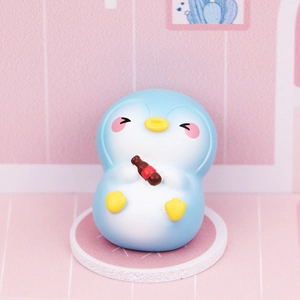 Mini cute penguin figurine holding a brown soda bottle for desk decoration