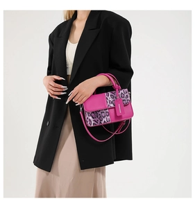 Detail of pink leather handbag with leopard print and a branded hanging fashion tag