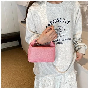 Pink striped fabric tote bag with wide integrated handle and compact trapezoid shape