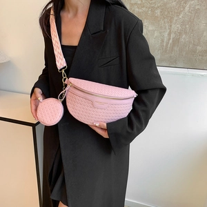 Pink woven crossbody fanny pack with matching round coin purse and geometric strap