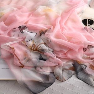 Elegant pink gradient silk scarf with ink floral print for autumn sun protection