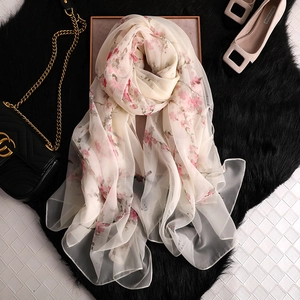 Elegant floral silk scarf for women featuring pink cherry blossoms on cream background