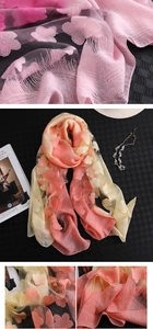 Détail de l'écharpe dégradée rose et jaune avec broderies de fleurs 3D délicates