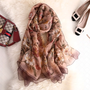 Detailed texture of lightweight floral chiffon shawl with elegant semi-transparent finish