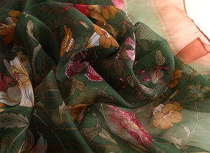 Close-up of lightweight chiffon silk scarf with vintage floral and bee pattern prints
