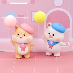 Close-up of cute shiba inu and white bear figurines holding colorful balloons