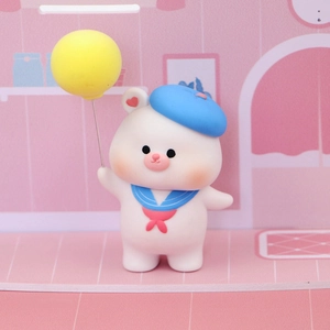 Cute white bear figurine with blue beret and yellow balloon for cake decoration