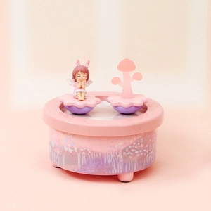 Dreamy pink music box with a cute praying girl, rabbit ears and star-patterned base