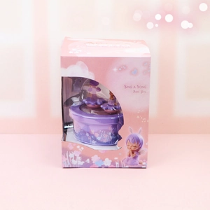 Purple musical box with angel figurine in a gift box with a transparent display window
