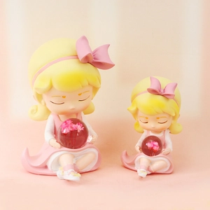 Detailed comparison of two cute girl figurine night lights in pink and yellow tones