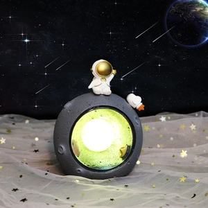 Creative astronaut moonlight night lamp for kids bedroom with warm glowing lunar base