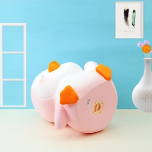 Pink penguin piggy bank with a bottom twist-lock lid shown from a side-view angle