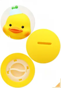 Detail view of large duck piggy bank showing coin slot and bottom rotary opening