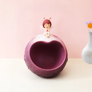 Detail of creative planet storage ornament with sweet girl figurine in a home setting