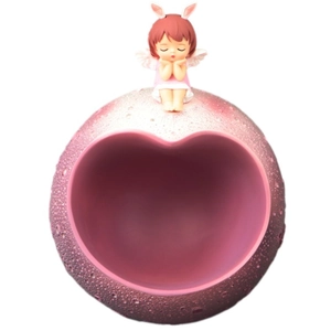 Pink heart-shaped tray with cute rabbit-eared girl figurine for key storage and home decor