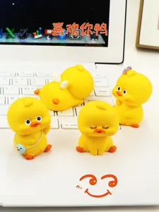 Set of four cute yellow duck figurines in creative poses for car dashboard and desk decor