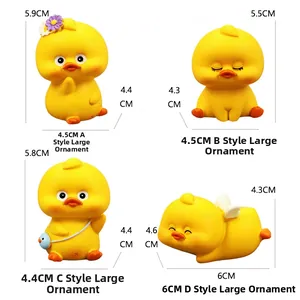 Detailed view of four cute yellow duck car ornaments with various poses and size markings