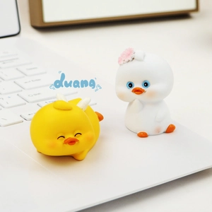 Cute yellow duck resin figurines for car dashboard and desk decor in a 2-piece set