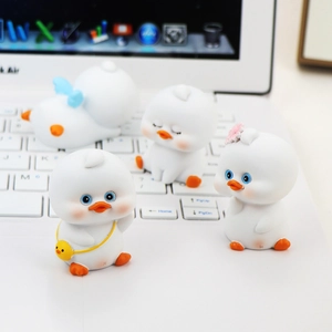 Set of four cute white duck resin ornaments for car dashboard and desk decor