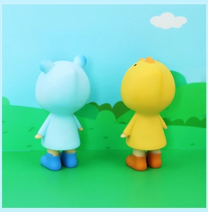 Rear view of cute bear and chick figurines in colorful raincoats on a cartoon background