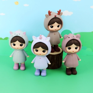 Set of four cute girl figurines in animal hoods like bear and deer for desk decoration