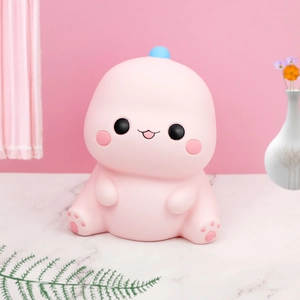 Veilleuse dinosaure rose mignon en silicone pour chambre d enfant sur marbre blanc
