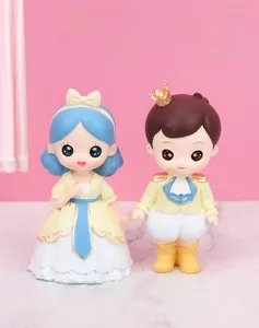 Close-up of cute resin Prince and Princess figures for cake and car dashboard decoration