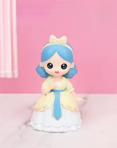 Detail of hand-painted resin princess figurine with blue hair and yellow bow decoration
