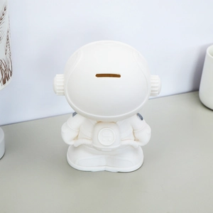 Large white astronaut piggy bank for kids featuring a sleek matte finish and coin slot