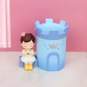 Blue castle desk organizer with a cute prince figurine for stationery and makeup brushes