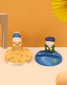 Macro view of chubby artist phone stands inspired by Van Gogh and Girl with a Pearl Earring
