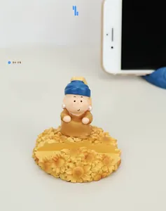 Detail of Girl with a Pearl Earring phone stand with sunflower resin base design