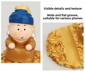 Detail view of the wide, flat groove on a creative resin figurine phone stand