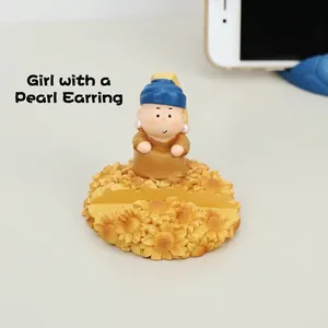 Creative resin phone holder with cartoon girl doll and sunflower base for desktop use