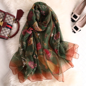 Long vintage silk-like sun protection scarf in dark green with floral and insect prints