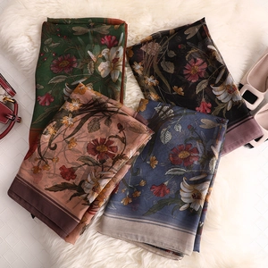 Floral print sun protection silk scarves in four elegant colors on faux fur rug
