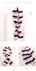 Detailed views of a striped silk scarf with pink, white, and navy blue patterns