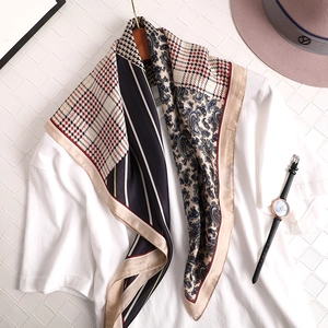 Elegant plaid paisley silk scarf with navy stripes and beige patterns on white T-shirt