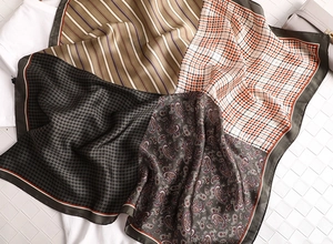 Detail of retro patchwork square scarf with houndstooth and paisley silk patterns