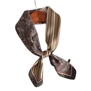 Elegant paisley and stripe pattern silk square scarf hanging on a wooden hanger