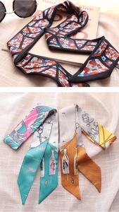 Detail of multi-style twilly silk scarves with architectural and nautical pattern prints