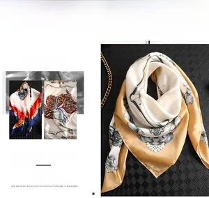 Macro detail of elegant silk square scarf with vintage royal heraldic pattern and glossy finish
