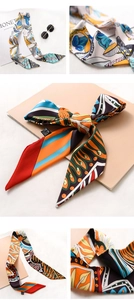 Detail of floral and abstract print twilly scarves with 100% polyester fabric care label