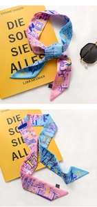 Detail of pink and blue silk scarf with H-letter pattern and abstract artistic print