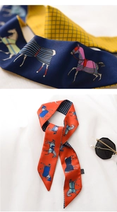 Detail of elegant horse print twilly scarf with fine twill texture and vibrant patterns
