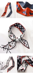 Detailed dual-sided silk scarf featuring horse patterns and plaid prints with fine stitching