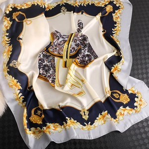Detail of silk scarf with navy and gold equestrian motifs and baroque patterns
