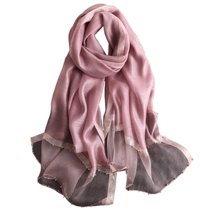 Elegant silk sun protection shawl with beads and gold trim in gradient pink and grey