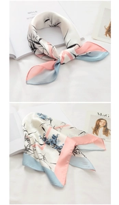 Detail view showing ink wash bamboo print silk scarf with pink and blue border