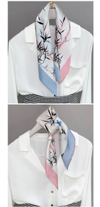 Ink-style bamboo print silk scarf with contrast pink and blue edges on white shirt collar
